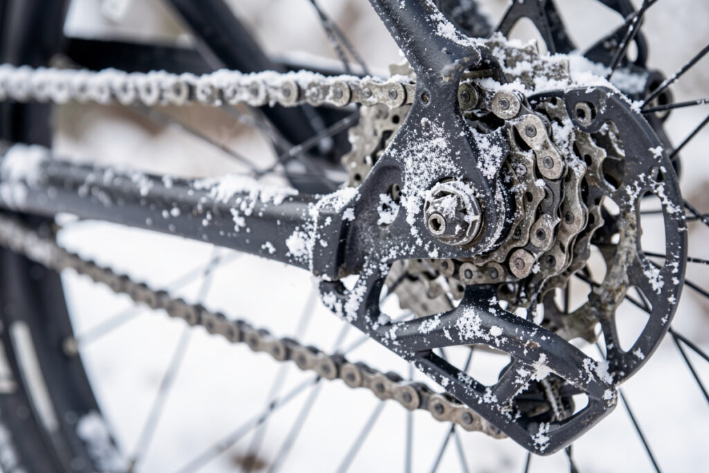 Salt-crusted e-bike chain and derailleur after a winter ride